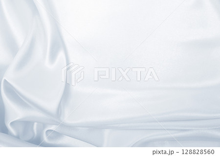 Smooth elegant grey silk or satin luxury cloth as wedding background. Luxurious background design 128828560