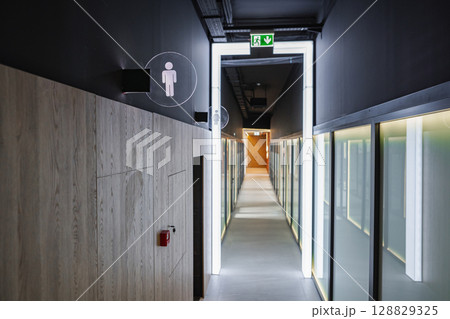 Long Hallway With Toilet Sign Long Hallway With Toilet Sign 128829325