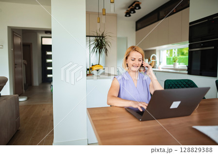 Engaging conversation while multitasking at home office 128829388