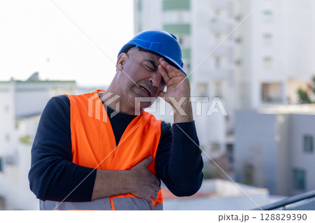 Stressed and worried mechanical technician or building contractor 128829390