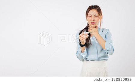 Healthcare for sick woman, flu sore throat asian with thermometer, feels sick, and touches her neck because of the pain, a healthy lifestyle is the goal, isolated studio white background Healthcare for sick woman, flu sore throat asian with thermometer, feels sick, and touches her neck because of the pain, a healthy lifestyle is the goal, isolated studio white background 128830982