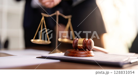 Legal Scales and Gavel on Office Desk Legal Scales and Gavel on Office Desk 128831054