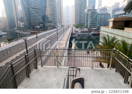 Dubai, UAE - September 29, 2024 Transport interchange in the city, organization of traffic of cars and pedestrians. Editorial 128831198