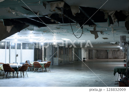 Retro Chairs and Tables Inside Neglected Underpass 128832009