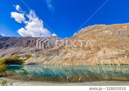 The autumn scenery with Hindu Kush mountain range in the background is very beautiful, Gahkuch,northern Pakistan. The autumn scenery with Hindu Kush mountain range in the background is very beautiful, Gahkuch,northern Pakistan. 128832018
