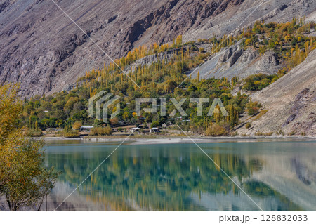 The autumn scenery with Hindu Kush mountain range in the background is very beautiful, Gahkuch,northern Pakistan. 128832033