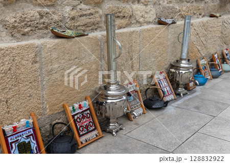 Street marketplace with traditional artifacts including a shiny samovar Street marketplace with traditional artifacts including a shiny samovar 128832922