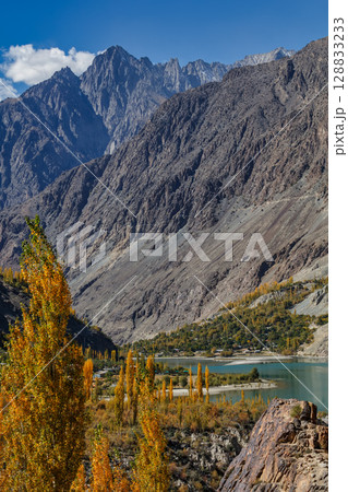The autumn scenery with Hindu Kush mountain range in the background is very beautiful, Gahkuch,northern Pakistan. The autumn scenery with Hindu Kush mountain range in the background is very beautiful, Gahkuch,northern Pakistan. 128833233