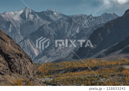 The autumn scenery with Hindu Kush mountain range in the background is very beautiful, Gahkuch,northern Pakistan. The autumn scenery with Hindu Kush mountain range in the background is very beautiful, Gahkuch,northern Pakistan. 128833241