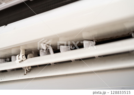 Mold on air conditioner close-up. Air conditioner maintenance and cleaning. 128833515