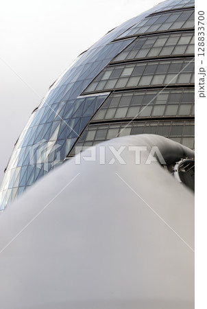 Perspective of stainless steel handrail with City Hall in the background. Perspective of stainless steel handrail with City Hall in the background. 128833700
