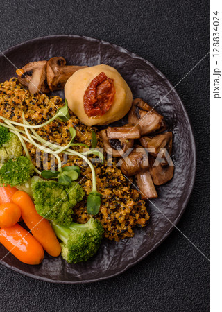 Food bowl with tofu, quinoa, broccoli and carrots, microgreens 128834024