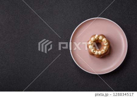 Round chocolate tart or pie with cream berry filling 128834517