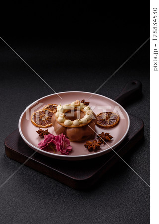 Round chocolate tart or pie with cream berry filling 128834530