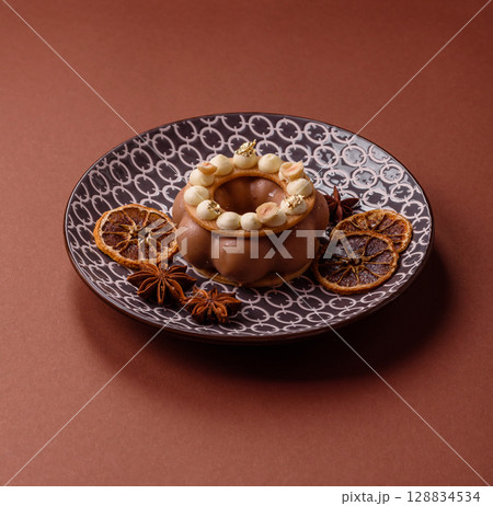 Round chocolate tart or pie with cream berry filling Round chocolate tart or pie with cream berry filling 128834534