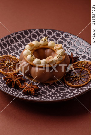 Round chocolate tart or pie with cream berry filling Round chocolate tart or pie with cream berry filling 128834538