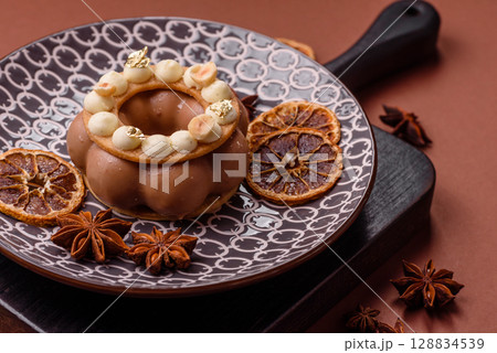 Round chocolate tart or pie with cream berry filling 128834539