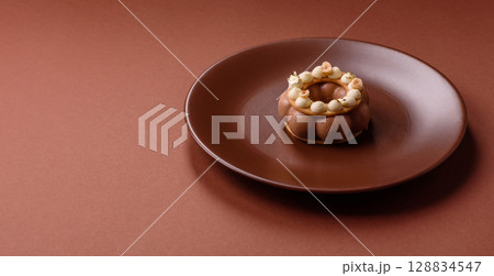 Round chocolate tart or pie with cream berry filling 128834547