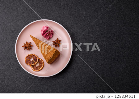 A slice of honey puff cake or pumpkin, carrot and cream pie, vegan sweets A slice of honey puff cake or pumpkin, carrot and cream pie, vegan sweets 128834611