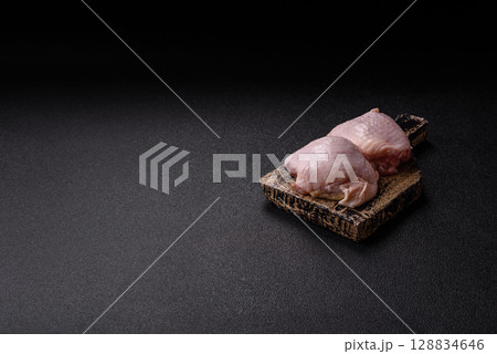 Chicken thigh raw, fresh poultry meat with salt and spices 128834646