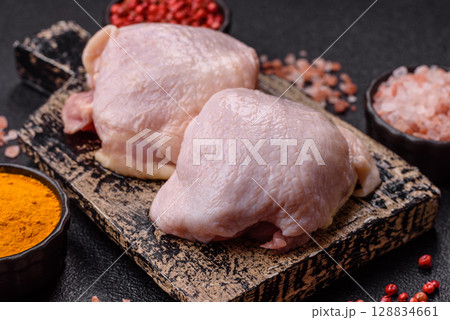 Chicken thigh raw, fresh poultry meat with salt and spices 128834661