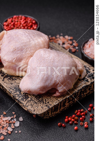 Chicken thigh raw, fresh poultry meat with salt and spices 128834666