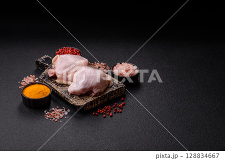 Chicken thigh raw, fresh poultry meat with salt and spices 128834667