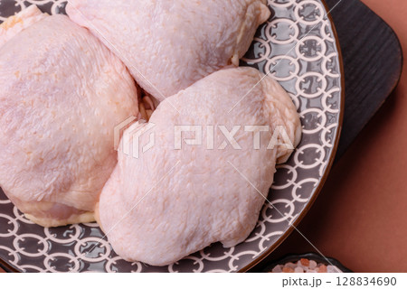 Chicken thigh raw, fresh poultry meat with salt and spices 128834690