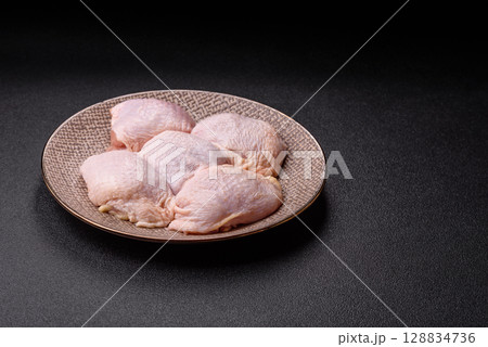 Chicken thigh raw, fresh poultry meat with salt and spices 128834736
