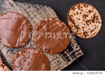 Matzah with chocolate paste for the Jewish holiday of passover 128834758