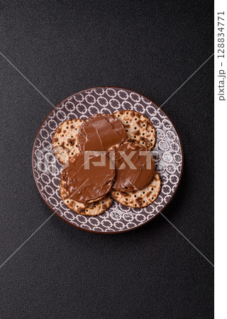 Matzah with chocolate paste for the Jewish holiday of passover 128834771