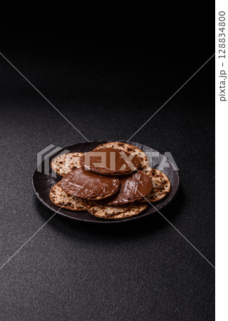 Matzah with chocolate paste for the Jewish holiday of passover Matzah with chocolate paste for the Jewish holiday of passover 128834800