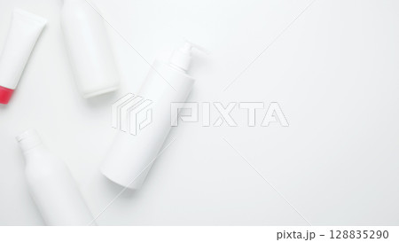 Bottles and tubes with branding mock up. Cosmetic beauty products. Skin care and beauty concept Bottles and tubes with branding mock up. Cosmetic beauty products. Skin care and beauty concept 128835290
