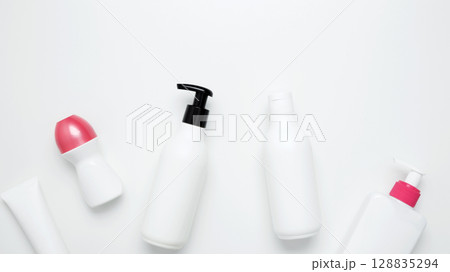 Skin care and beauty concept. Cosmetic beauty products. Bottles and tubes with branding mock up Skin care and beauty concept. Cosmetic beauty products. Bottles and tubes with branding mock up 128835294