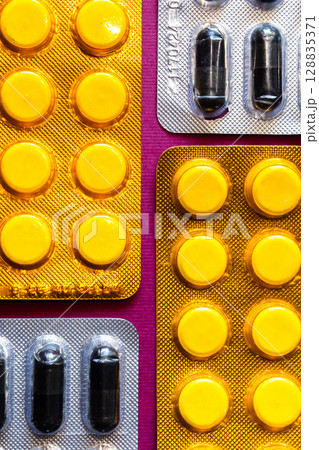 Lots of pills in a blister packs. Medical drug. Medicine. Medical background 128835371