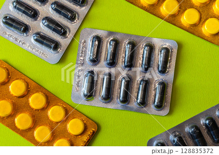 Lots of pills in a blister packs. Medical drug. Medicine. Medical background Lots of pills in a blister packs. Medical drug. Medicine. Medical background 128835372
