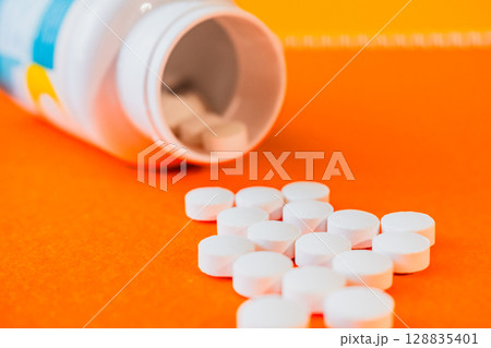 Lots of pills in a blister packs. Medical drug. Medicine. Medical background Lots of pills in a blister packs. Medical drug. Medicine. Medical background 128835401