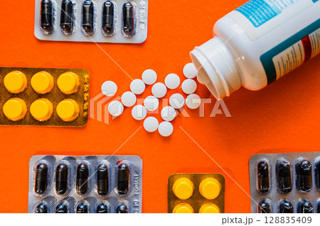 Lots of pills in a blister packs. Medical drug. Medicine. Medical background Lots of pills in a blister packs. Medical drug. Medicine. Medical background 128835409