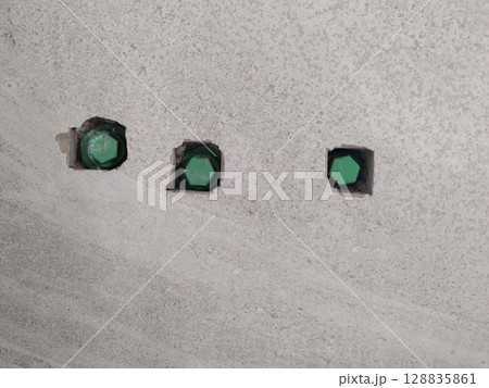 Green Pipe Installed in Bathroom Tile Hole Made with Cutter Machine for Fitting Accessories Setup Green Pipe Installed in Bathroom Tile Hole Made with Cutter Machine for Fitting Accessories Setup 128835861