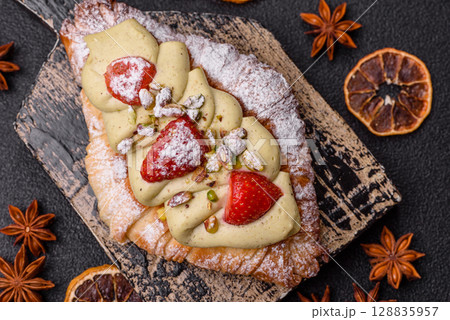 Food for breakfast sweet strawberry croissants with chocolate filling Food for breakfast sweet strawberry croissants with chocolate filling 128835957
