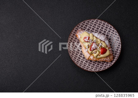 Food for breakfast sweet strawberry croissants with chocolate filling Food for breakfast sweet strawberry croissants with chocolate filling 128835965