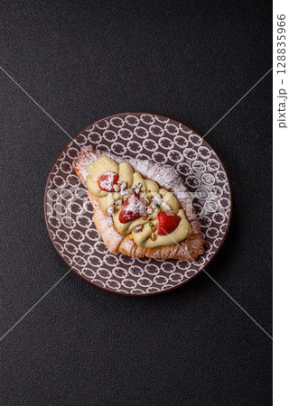 Food for breakfast sweet strawberry croissants with chocolate filling Food for breakfast sweet strawberry croissants with chocolate filling 128835966