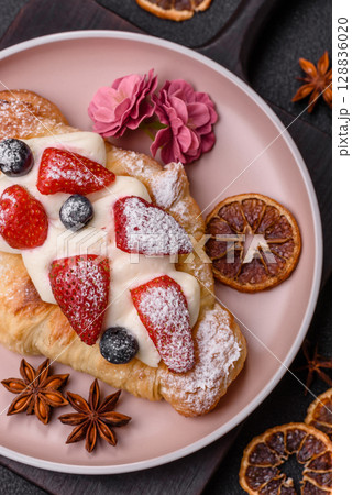 Food for breakfast sweet strawberry croissants with chocolate filling Food for breakfast sweet strawberry croissants with chocolate filling 128836020