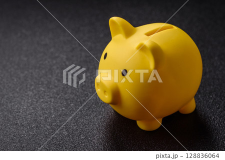 Piggy bank as a financial conceptual background with coins, doing business, saving money Piggy bank as a financial conceptual background with coins, doing business, saving money 128836064