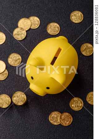 Piggy bank as a financial conceptual background with coins, doing business, saving money 128836081