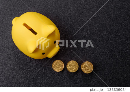 Piggy bank as a financial conceptual background with coins, doing business, saving money Piggy bank as a financial conceptual background with coins, doing business, saving money 128836084