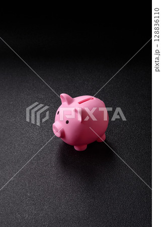 Piggy bank as a financial conceptual background with coins, doing business, saving money 128836110