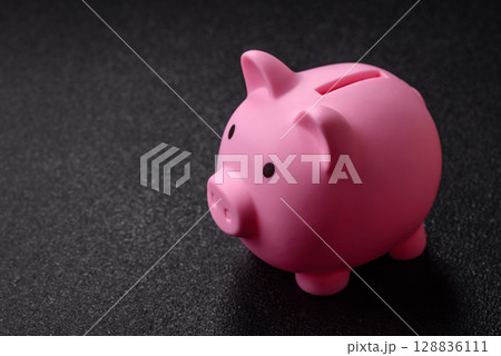 Piggy bank as a financial conceptual background with coins, doing business, saving money 128836111