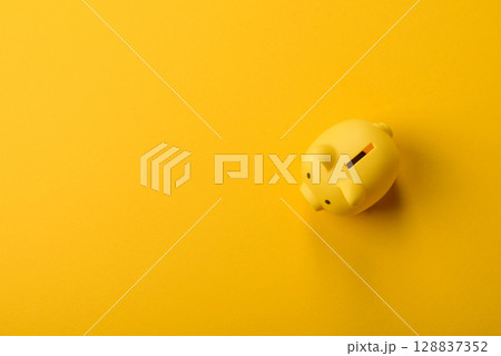 Piggy bank as a financial conceptual background with coins, doing business Piggy bank as a financial conceptual background with coins, doing business 128837352