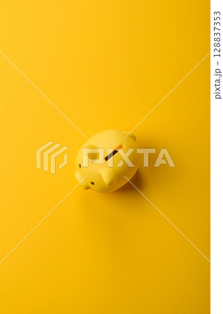 Piggy bank as a financial conceptual background with coins, doing business Piggy bank as a financial conceptual background with coins, doing business 128837353